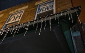 Icicles form on an awning, and the windows above Union Street Market spell out “OH YEAH!” as part of the popular cheer, “O U Oh Yeah!” for Ohio University.
A large snow storm sweeps through the Midwest starting early Monday morning February 15, 2021 and is predicted to continue through Tuesday February 16, 2021. (Photo by Stephen Zenner / SOPA Images/Sipa USA)