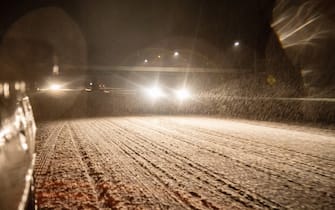 Cars drive on a snow covered highway 50.
A large snow storm sweeps through the Midwest starting early Monday morning February 15, 2021 and is predicted to continue through Tuesday February 16, 2021. (Photo by Stephen Zenner / SOPA Images/Sipa USA)