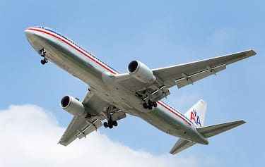 ROSEMONT, IL - SEPTEMBER 3:  An American Airlines jet is seen in the air preparing to land September 3, 2004 at Chicago's O'Hare International Airport in Rosemont, Illinois. American Airlines announced December 10, 2004 that they will be raising domestic airfares $10 for round-trip and $5 for one-way trips due to jet fuel expense.  (Photo by Tim Boyle/Getty Images)