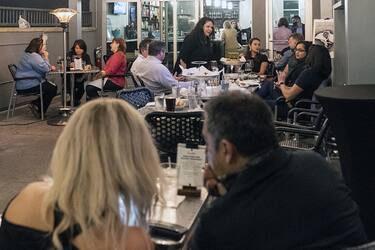 Customers sit at Harolds Restaurant in Houston, Texas, U.S., on Wednesday, March 10, 2021. Texas Governor Greg Abbott has lifted anti-pandemic restrictions and allowed businesses to open at full capacity. Photographer: Go Nakamura/Bloomberg via Getty Images