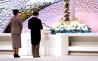 epa09066841 Japan's Emperor Naruhito (R) accompanied by Empress Masako (L) delivers his speech in front of the altar for victims of the 11 March 2011 earthquake and tsunami at the national memorial service in Tokyo, Japan, 11 March 2021. The ceremony took place on the 10th anniversary of the 9.0 magnitude earthquake which triggered a tsunami and nuclear disaster.  EPA/Behrouz MEHRI / POOL