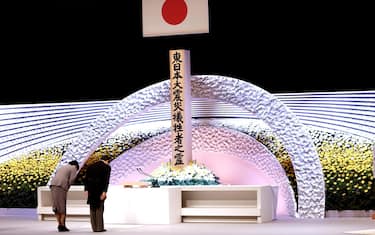 epa09066842 Japan's Emperor Naruhito (R) and Empress Masako (L) bow in front of the altar for victims of the 11 March 2011 earthquake and tsunami at the national memorial service in Tokyo, Japan, 11 March 2021. The ceremony took place on the 10th anniversary of the 9.0 magnitude earthquake which triggered a tsunami and nuclear disaster.  EPA/Behrouz MEHRI / POOL