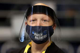 INDIANAPOLIS, INDIANA - MARCH 19: A fan looks on wearing a 
"March Madness" mask before the Virginia Tech Hokies take on the Florida Gators in the first round game of the 2021 NCAA Men's Basketball Tournament at Hinkle Fieldhouse on March 19, 2021 in Indianapolis, Indiana. (Photo by Andy Lyons/Getty Images)