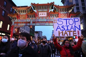 WASHINGTON, DC - MARCH 17: Activists participate in a vigil in response to the Atlanta spa shootings March 17, 2021 in the Chinatown area of Washington, DC. A gunman opened fire in three spas in the Atlanta, Georgia area, the day before killing eight people, including six women of Asian descent. (Photo by Alex Wong/Getty Images)