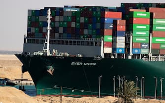 SUEZ, EGYPT - MARCH 29: The container ship 'Ever Given' is refloated, unblocking the Suez Canal on March 29, 2021 in Suez, Egypt. This morning the container ship came partly unstuck from the shoreline, where it ran aground in the canal last Tuesday, and later resumed its course shortly after 3pm local time. The Suez Canal is one of the world's busiest shipping lanes and the blockage had created a backlog of vessels at either end, raising concerns over the impact on global shipping and supply chains. (Photo by Mahmoud Khaled/Getty Images)
