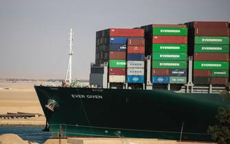 SUEZ, EGYPT - MARCH 29: The container ship 'Ever Given' is refloated, unblocking the Suez Canal on March 29, 2021 in Suez, Egypt. This morning the container ship, which is operated by Evergreen Marine Corp., came partly unstuck from the shoreline, where it ran aground in the canal last Tuesday, and later resumed its course shortly after 3pm local time. The Suez Canal is one of the world's busiest shipping lanes and the blockage had created a backlog of vessels at either end, raising concerns over the impact on global shipping and supply chains. (Photo by Mahmoud Khaled/Getty Images)

