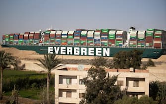 SUEZ, EGYPT - MARCH 29: The container ship, the Ever Given, is seen moving at the Suez Canal on March 29, 2021 in Suez, Egypt. Early Monday, the Suez Canal Authority said the angle of the Ever Given, a huge container ship stuck in the canal, had been corrected by 80 percent. The ship ran aground in the canal last Tuesday, after being caught in 40-knot winds. The Suez Canal is one of the worlds busiest shipping lanes and the blockage has created a backlog of vessels at either end, raising concerns over the impact the accident will have on global shipping and supply chains. (Photo by Mahmoud Khaled/Getty Images)