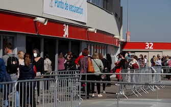 epa09092990 People queue up at Wanda Metropolitano stadium to be vaccinated against Covid-19 in Madrid, Spain, 24 March 2021. Spain resumes the use of the Astrazeneca coronavirus vaccine after a 10-day-long pause in its administration following the European Medicines Agency (EMA) announcement to uphold its approval of the vaccine. Some of EU member countries countries stopped giving the vaccine over fears there might be links between the vaccination against Covid-19 with the AstraZeneca vaccine and a rare number of blood clots.  EPA/J.J. GUILLEN