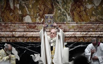 Pope Francis holds the Book of Gospels as he celebrates Easter Mass on April 04, 2021 at St. Peter's Basilica in The Vatican during the Covid-19 coronavirus pandemic. (Photo by Filippo MONTEFORTE / POOL / AFP) (Photo by FILIPPO MONTEFORTE/POOL/AFP via Getty Images)