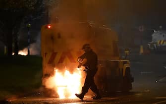 BELFAST, NORTHERN IRELAND - APRIL 03: Police attend the scene at Cloughfern as Loyalist protestors hijack and burn vehicles on April 3, 2021 in Belfast, Northern Ireland. Loyalist unrest and disorder in the province continues as a result of the implementation of the so called Irish sea border. (Photo by Charles McQuillan/Getty Images)