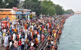epa09130368 Indian pilgrims take the holy dip in Ganga river during the Kumbh Mela royal bath (Sacred Hindu Pilgrimage) at Haridwar, Uttarakhand, India, 12 April 2021. Thousands of pilgrims are gathering and taking holy dip in Kumbh Mela that is a mass Hindu pilgrimage which occurs after every twelve years and rotates among four locations Prayag (Allahabad) at the confluence of the Ganga and Yamuna and mythical Saraswati river, Haridwar along the Ganga river, Ujjain along the Kshipra river and Nashik along the Godavari river.  EPA/IDREES MOHAMMED