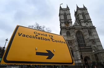 epa09065497 A Covid-19 vaccination centre sign outside Westminster Abbey in London, Britain, 10 March 2021. Westminster Abbey has opened its doors acting as a vaccination centre in London. More than twenty million people have already received their first dose of a Covid-19 vaccine in the UK.  EPA/ANDY RAIN