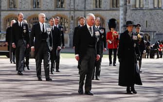 WINDSOR, ENGLAND - APRIL 17: Princess Anne, Princess Royal, Prince Charles, Prince of Wales, Prince Andrew, Duke of York, Prince Edward, Earl of Wessex, Prince William, Duke of Cambridge, Peter Phillips, Prince Harry, Duke of Sussex, Earl of Snowdon David Armstrong-Jones and Vice-Admiral Sir Timothy Laurence follow Prince Philip, Duke of Edinburgh's coffin during the Ceremonial Procession  during the funeral of Prince Philip, Duke of Edinburgh at Windsor Castle on April 17, 2021 in Windsor, England. Prince Philip of Greece and Denmark was born 10 June 1921, in Greece. He served in the British Royal Navy and fought in WWII. He married the then Princess Elizabeth on 20 November 1947 and was created Duke of Edinburgh, Earl of Merioneth, and Baron Greenwich by King VI. He served as Prince Consort to Queen Elizabeth II until his death on April 9 2021, months short of his 100th birthday. His funeral takes place today at Windsor Castle with only 30 guests invited due to Coronavirus pandemic restrictions. (Photo by Alastair Grant/WPA Pool/Getty Images)