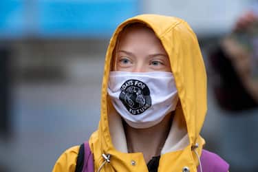 epa08731002 Swedish climate activist Greta Thunberg fronts a Fridays For Future protest at the Swedish Parliament (Riksdagen) in Stockholm, Sweden, 09 October 2020.  EPA/Jessica Gow  SWEDEN OUT