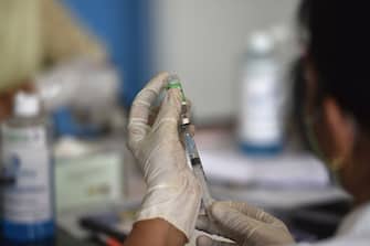 NOIDA, INDIA - APRIL 22: A health worker prepares a dose of Covishield vaccine at Bhangel CHC Hospital in Sector 110, on April 22, 2021 in Noida, India. (Photo by Sunil Ghosh/Hindustan Times via Getty Images)