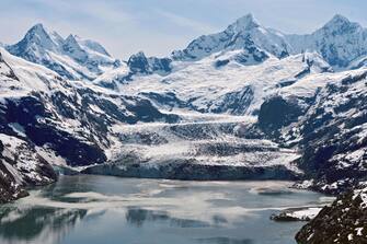 epa08517373 A handout picture made available by the National Aeronautics and Space Administration (NASA) shows the Johns Hopkins Glacier in southern Alaska, USA, 27 May 2020 (issued 30 June 2020). Johns Hopkins is one of more than 1,000 glaciers located within the boundaries of Glacier Bay National Park and Preserve. Most of the park's glaciers are found inland, high in the mountains. In contrast, Johns Hopkins Glacier flows eastward for miles from the Fairweather Range and down into the waters of Johns Hopkins Inlet in Glacier Bay. Johns Hopkins and other glaciers that end in seawater - so-called tidewater glaciers - primarily lose mass through the calving of icebergs.  EPA/NASA/OPERATION ICEBRIDGE HANDOUT  HANDOUT EDITORIAL USE ONLY/NO SALES