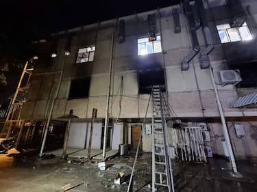 BAGHDAD, IRAQ - APRIL 24: A view of Ibn al-Hatip Hospital as fire erupts at the hospital where coronavirus patients were being treated in Baghdad, Iraq on April 24, 2021. Nearly 20 people died in a fire at a hospital where coronavirus patients were being treated in Baghdad, according to sources on Saturday. (Photo by Murtadha Al-Sudani/Anadolu Agency via Getty Images)