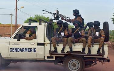 A picture take on October 30, 2018 shows Burkinabe gendarmes sitting on their vehicle in the city of Ouhigouya in the north of the country. - Two Burkinabe soldiers were killed and three wounded in the night of November 5, 2018 in Nassoumbou, northern Burkina Faso, near the Malian border, by the explosion of an improvised explosive device, according to security sources. (Photo by ISSOUF SANOGO / AFP)        (Photo credit should read ISSOUF SANOGO/AFP via Getty Images)