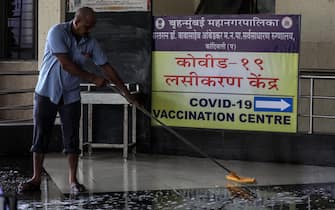 epa09169726 A sweeper cleans the floor outside a vaccination centre at Shatabdi hospital which is closed amid reported shortage of COVID-19 coronavirus vaccine in Mumbai, India, 30 April 2021. Brihanmumbai Municipal Corporation (BMC) announced to close the vaccination centre for the next three days from 30 April 2021 to 02 May 2021 due to shortage of vaccine in Mumbai. India has recently recorded a massive surge of fresh COVID-19 cases and deaths, the world's highest single-day rise since the beginning of the pandemic.  EPA/DIVYAKANT SOLANKI