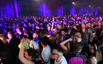 LIVERPOOL, ENGLAND - APRIL 30: People react on the dance floor as Nightclub Circus hosts the first dance event, which will welcome 6,000 clubbers to the city's Bramley-Moore Dock warehouse on April 30, 2021 in Liverpool, England. The event is part of the national Events Research Programme which will provide data on how events could be permitted to safely reopen. (Photo by Anthony Devlin/Getty Images)