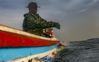 SENEGAL PHOTO ESSAY PLASTIC WASTE CRISIS epa07430586 (03/19) Senegalese fisherman Modu Samba catches a fish tens of nautical miles offshore in the Atlantic Ocean off the 400-year-old village of Ngor on the western most tip of Africa, Dakar, Senegal, 26 February 2019. Senegal is choking on plastic waste with tens of thousands of tons of it ending up in the ocean every year. A problem that is not only threatening the coastal population but also the economy. Due to a lack of comprehensive municipal waste management mechanisms, communities have engaged in their own clean ups in some villages. Environmentalists urge a change of policy regarding the use of plastics is urgently needed by government. EPA/NIC BOTHMA ATTENTION: For the full PHOTO ESSAY text please see Advisory Notice epa07430583