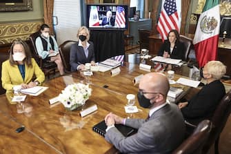 U.S. Vice President Kamala Harris, center right, listens while meeting virtually with Andres Manuel Lopez Obrador, Mexico's president, in Washington, D.C., U.S., on Friday, May 7, 2021. The two are expected to discuss working together to address relief needs in Guatemala and deepening cooperation on migration. Photographer: Oliver Contreras/UPI/Bloomberg via Getty Images