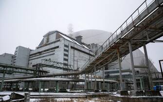 epa05685632 The new protective shelter over the remains of the nuclear reactor Unit 4, at Chernobyl nuclear power plant, in Chernobyl, Ukraine, 22 December 2016. The new mobile structure will secure the affected fourth reactor. The shelter is over 105 metres tall and weighs 36,000 tons. The explosion of Unit 4 of the Chernobyl nuclear power plant in the early hours of 26 April 1986 is still regarded the biggest accident in the history of nuclear power generation.  EPA/ROMAN PILIPEY