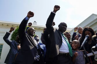 Gianna Floyd, daughter of George Floyd, along with other family members and lawyers, raise fists and say his name while facing reporters at the White House following their meeting with President Joe Biden in Washington, U.S., May 25, 2021. REUTERS/Kevin Lamarque