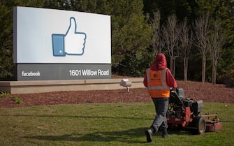 (FILE) USA GERMANY JUSTICE FACEBOOK epa08443368 (FILE) - A file photo dated 31 January 2012 showing a grounds keeper mowing the lawn in front of Facebook's new Corporate headquarters in Menlo Park, California, USA (reissued 25 May 2020). German federal court, BGH, is due to announce its long awaited decision 29 May 2020 in data protection lawsuit in a consumer centres vs Facebook case. EPA/PETER DaSILVA *** Local Caption *** 53295296
