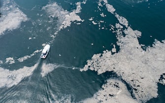 An aerial photo made with a drone shows a fishing boat sailing in the sea-snot covered Marmara sea near Istanbul, Turkey, 30 May 2021. Because of global heating, a blanket of a mucus-like substance, increasing day by day, is threatening the fishing industry and the environment in the Marmara sea. The major reason is that the water temperature in the Marmara sea is 2.5 degrees above the average of the last 40 years.  ANSA/ERDEM SAHIN  ATTENTION: This Image is part of a PHOTO SET