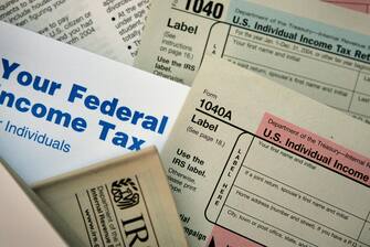 CHICAGO - NOVEMBER 1:  Current federal tax forms are distributed at the offices of the Internal Revenue Service November 1, 2005 in Chicago, Illinois. A presidential panel today recommended a complete overhaul of virtually every tax law for individuals and businesses.  (Photo Illustration by Scott Olson/Getty Images)