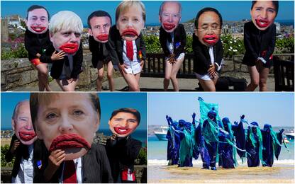 G7, leader seminudi e con bocca gigante: protesta attivisti ambiente