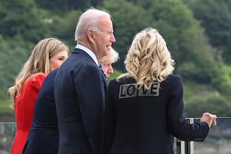 U.S. first lady Jill Biden wearing a jacket with the phrase "Love" stands next to U.S. President Joe Biden, Britain's Prime Minister Boris Johnson and his wife Carrie Johnson, during their meeting, at Carbis Bay, Cornwall, Britain June 10, 2021. REUTERS/Toby Melville/Pool