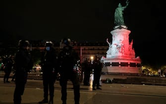 Police stand after dispersing the crowd during the French midsummer Festival of Music, "Fete de la Musique" on Place de la Republique in Paris on June 21, 2021. - France celebrates music in all its forms with a giant street party on June 21. (Photo by GEOFFROY VAN DER HASSELT / AFP) (Photo by GEOFFROY VAN DER HASSELT/AFP via Getty Images)