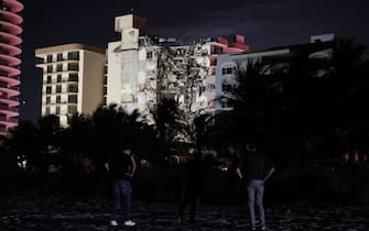 SURFSIDE, FLORIDA - JUNE 24:  A portion of the 12-story condo tower crumbled to the ground during a partial collapse of the building on June 24, 2021 in Surfside, Florida. It is unknown at this time how many people were injured as search-and-rescue effort continues with rescue crews from across Miami-Dade and Broward counties. (Photo by Joe Raedle/Getty Images)