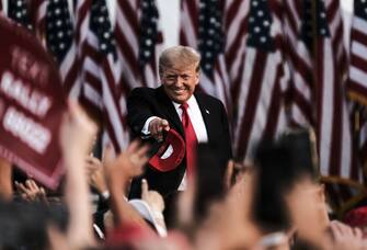 Former US President Donald Trump tosses out MAGA hats and greets his supporters during a 'Save America' Rally at the Lorain County Fairgrounds in Wellington, Ohio, U.S., on Saturday, June 26, 2021. The rally marks Trump's first rally in Ohio since he won the state in the 2020 presidential election, but Ohio's top two Republicans -- Governor Mike DeWine and Lt. Governor John Husted will not attend, according to The Columbus Dispatch. Photographer: Matthew Hatcher/Bloomberg via Getty Images