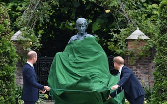 The Duke of Cambridge (left) and Duke of Sussex look at a statue they commissioned of their mother Diana, Princess of Wales, in the Sunken Garden at Kensington Palace, London, on what would have been her 60th birthday. Picture date: Thursday July 1, 2021.