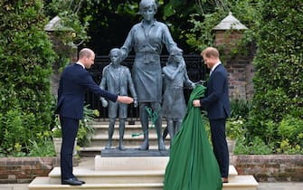 The Duke of Cambridge (left) and Duke of Sussex unveiling a statue they commissioned of their mother Diana, Princess of Wales, in the Sunken Garden at Kensington Palace, London, on what would have been her 60th birthday. Picture date: Thursday July 1, 2021.