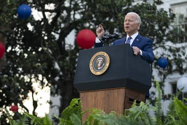 U.S. President Joe Biden speaks during a Fourth of July event on the South Lawn of the White House in Washington, D.C., U.S., on Sunday, July 4, 2021. The White House invited hundreds of essential workers, military families and administration staff members to view the Independence Day fireworks on the South Lawn as Biden touts a government vaccination drive that has helped get at least one dose to 67% of adults in the U.S. Photographer: Sarah Silbiger/Bloomberg via Getty Images