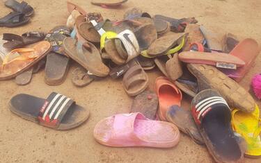 Shoes of abducted boarding school students lie on the floor after 140 boarding students of Bethel Baptist School were kidnapped by gunmen in Kaduna, northwestern Nigeria, on July 5, 2021. - Gunmen kidnapped 140 students from a boarding school in northwestern Nigeria on July 5, 2021, a school official said, the latest in a wave of mass abductions targetting schoolchildren and students. (Photo by Kehinde Gbenga / AFP) (Photo by KEHINDE GBENGA/AFP via Getty Images)