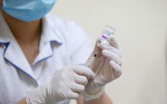 epa09275169 A nurse prepares a shot of COVID-19 vaccine developed by AstraZeneca (Vaxzevria) at a hospital, in Hanoi, Vietnam, 16 June 2021. More than 59,000 people in Vietnam have been fully vaccinated against the coronavirus disease (COVID-19), according to latest official data.  EPA/LUONG THAI LINH