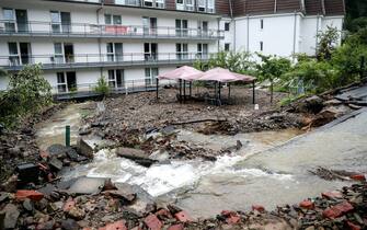 epa09343911 A flooded backyard of an evacuated retirement home as heavy rain hits Hagen, Germany, 14 July 2021. Large parts of North Rhine-Westphalia were hit by heavy, continuous rain Tuesday evening. According to the German Weather Service (DWD), the rain is not expected to let up until 15 July. The Rhine level has risen significantly in recent days.  EPA/FRIEDEMANN VOGEL