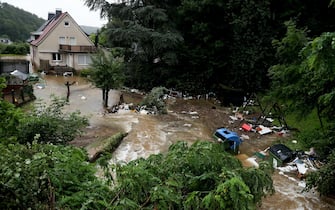 epa09343914 A flooded backyard of an evacuated retirement home as heavy rain hits Hagen, Germany, 14 July 2021. Large parts of North Rhine-Westphalia were hit by heavy, continuous rain Tuesday evening. According to the German Weather Service (DWD), the rain is not expected to let up until 15 July. The Rhine level has risen significantly in recent days.  EPA/FRIEDEMANN VOGEL