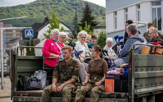 Bundeswehr soldiers evacuate a hospital after flooding in Bad Neuenahr, Germany, 15 July 2021. Large parts of Western Germany were hit by heavy, continuous rain in the night to 14 July, resulting in local flash floods that destroyed buildings and swept away cars.  EPA/CONSTANTIN ZINN