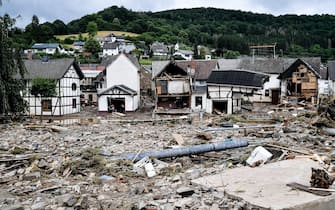 epa09345883 The   village of Schuld in the district of Ahrweiler is destroyed after heavy flooding of the river Ahr, in Schuld, Germany, 15 July 2021. Large parts of Western Germany were hit by heavy, continuous rain in the night to 15 July, resulting in local flash floods that destroyed buildings and swept away cars.  EPA/SASCHA STEINBACH