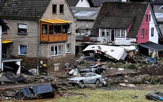 epa09345716 A damaged houses  and cars after flooding in Schuld, Germany, 15 July 2021. Large parts of western Germany were hit by heavy, continuous rain in the night to Wednesday, resulting in local flash floods that destroyed buildings and swept away cars.  EPA/SASCHA STEINBACH