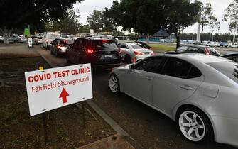 epa09343224 Long queues of cars are seen at a pop up COVID-19 testing clinic at the Fairfield Showgrounds in Sydney, New South Wales, 14 July 2021. There are reports of chaos at COVID-10 testing sites in Sydney's southwest as essential workers wait for hours in queues to get tested as the lockdown is set to be extended.  EPA/MICK TSIKAS AUSTRALIA AND NEW ZEALAND OUT