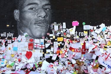 MANCHESTER, ENGLAND - JULY 14: A general view of newly repaired mural of England footballer Marcus Rashford by the artist known as AKSE_P19, which is displayed on the wall of a cafe on Copson Street, Withington on July 14, 2021 in Manchester, England. Rashford and other Black players on England's national football team have been the target of racist abuse, largely on social media, after the team's loss to Italy in the UEFA European Football Championship last night. England manager Gareth Southgate, Prime Minister Boris Johnson, and the Football Association have issued statements condemning the abuse. (Photo by Charlotte Tattersall/Getty Images)