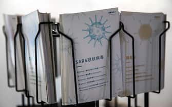 WUHAN, CHINA - JULY 18: (CHINA OUT) A SARS virus display card is seen at the "Enlightenment Of COVID-19" science exhibition on July 18, 2021 in Wuhan, Hubei Province, China.  The exhibition aims to explain the unique life form of the coronavirus and the thinking behind China's fight against the pandemic, as well as exploring ways to achieve a long-term coexistence with the virus. With no recorded cases of COVID-19 community transmissions since May 2020, life for residents in Wuhan is gradually returning to normal. (Photo by Getty Images)