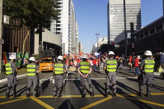 SAO PAULO, BRAZIL - JULY 24: People take part in a demonstration against the Brazilian President Jair Bolsonaro's handling of the coronavirus (COVID-19) pandemic in Sao Paulo, Brazil, on July 24, 2021. - Thousands of Brazilians took to the streets Saturday to protest against President Jair Bolsonaro, who faces an investigation over an allegedly corrupt Covid vaccine deal. (Photo by Cristina Szucinski/Anadolu Agency via Getty Images)